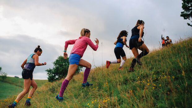 Group of female runners racing in the nature