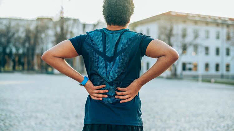 Läufer mit Rückenschmerzen